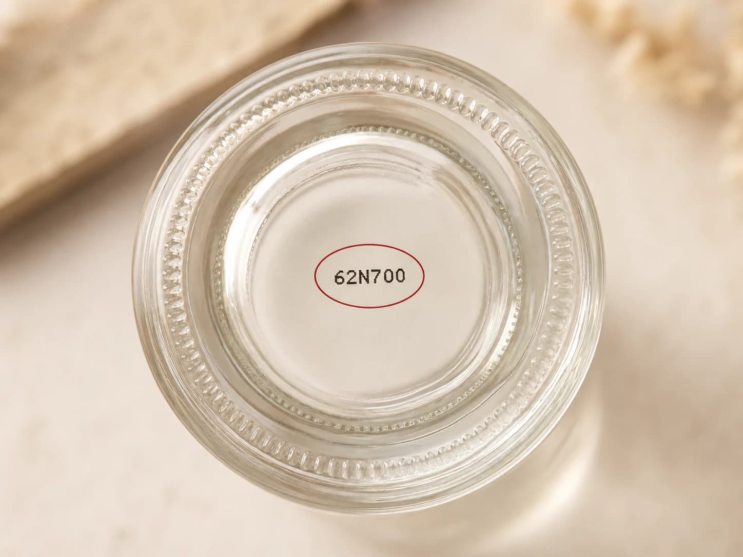 Batch code printed on the base of a cosmetic bottle